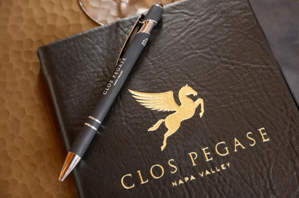 Clos Pegase Winery tasting room form sits on a table,...