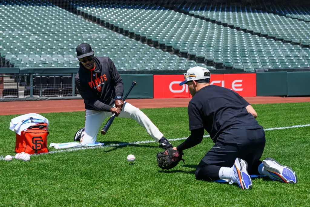 San Francisco Giants infield coach Ron Washington runs infield drills...