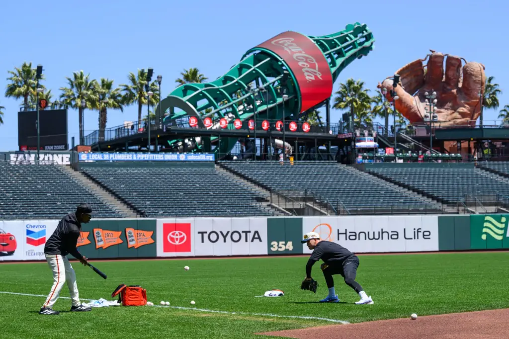 San Francisco Giants infield coach Ron Washington runs infield drills...
