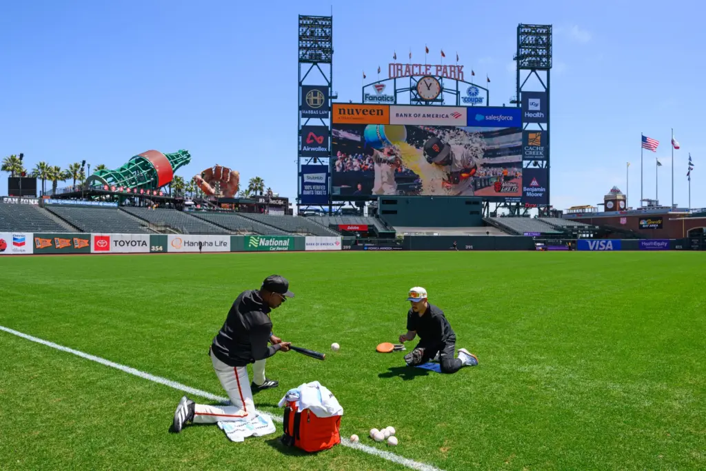 San Francisco Giants infield coach Ron Washington runs infield drills...