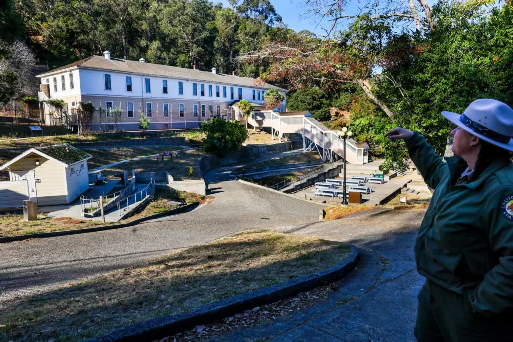 Angel Island State Park Interpreter Casey Dexter-Lee points at the...