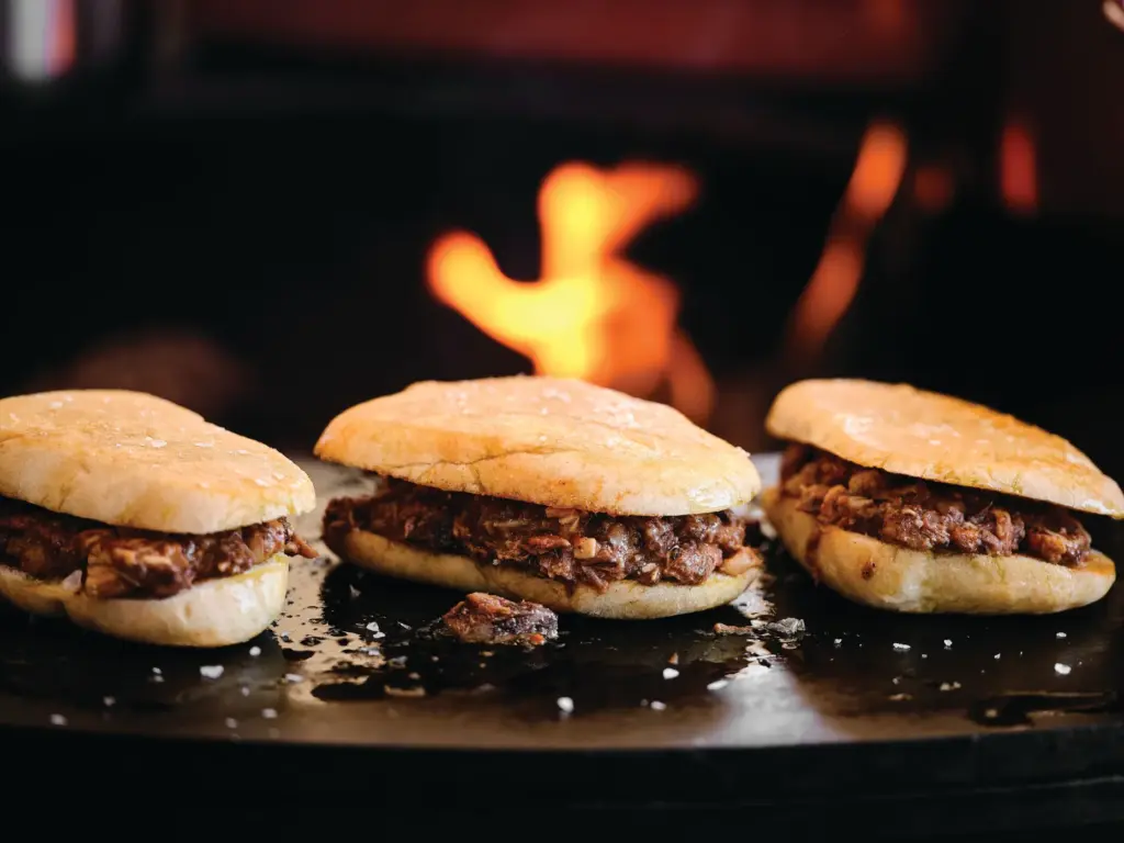 Mollete de pringa — a Spanish meat sandwich and bun...