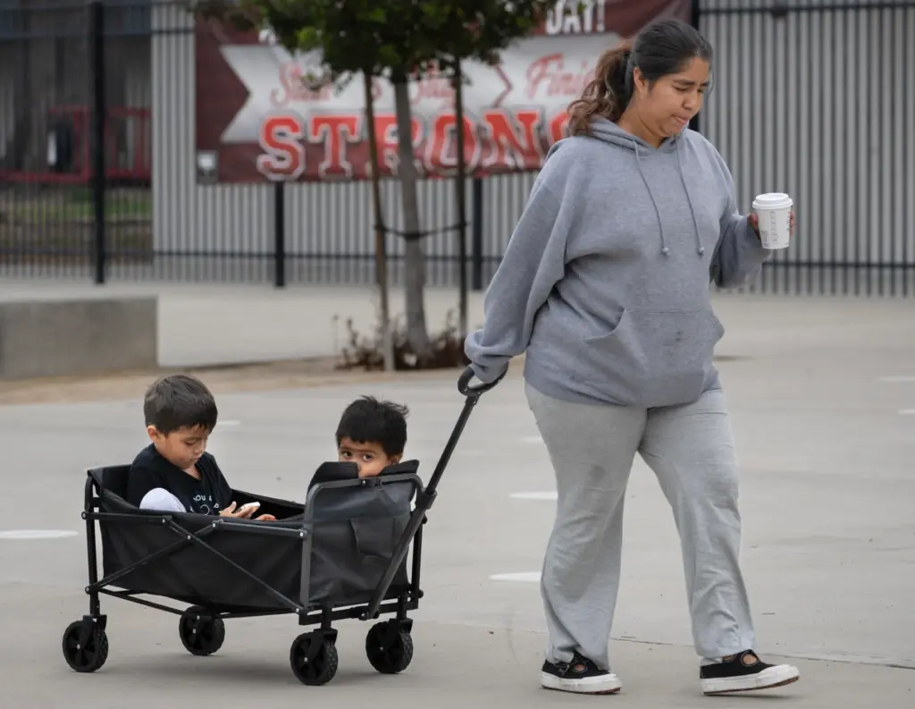 Joselin Vazquez and her two boys Calos, 4, left, and...