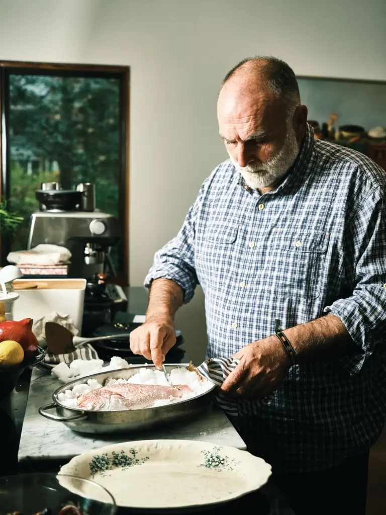 Chef JosÃ© AndrÃ©s cooks a fish in a photo from...