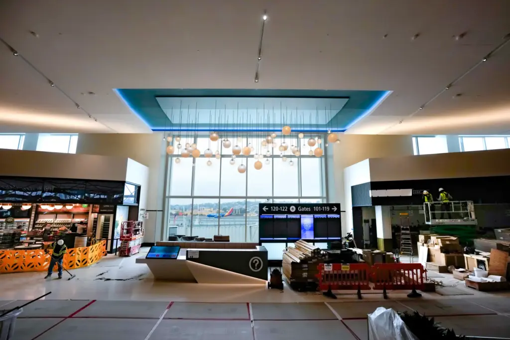 Framed within the window of the new Terminal 1, a...