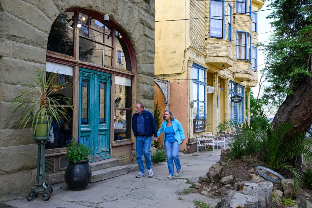 Pedestrians walk along Canyon Lake Drive in Port Costa, Calif.,...