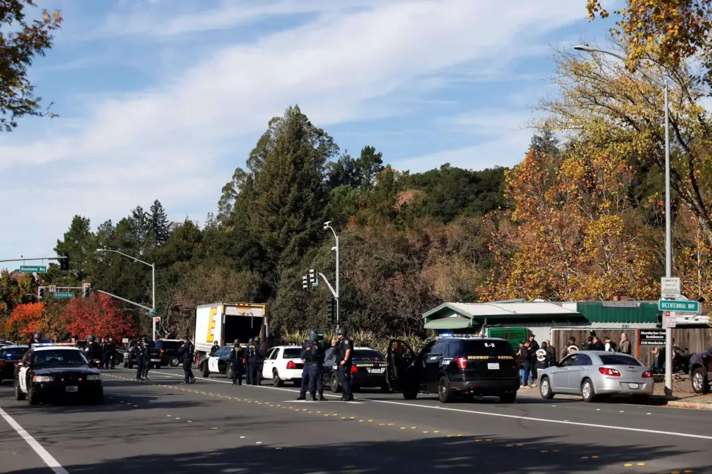 California Highway Patrol officers cordon off Mendocino Avenue in front...