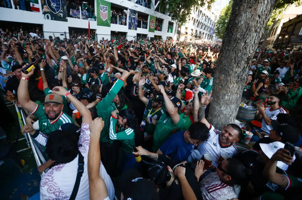 Mexico soccer fans celebrate a goal by Mexico in the...
