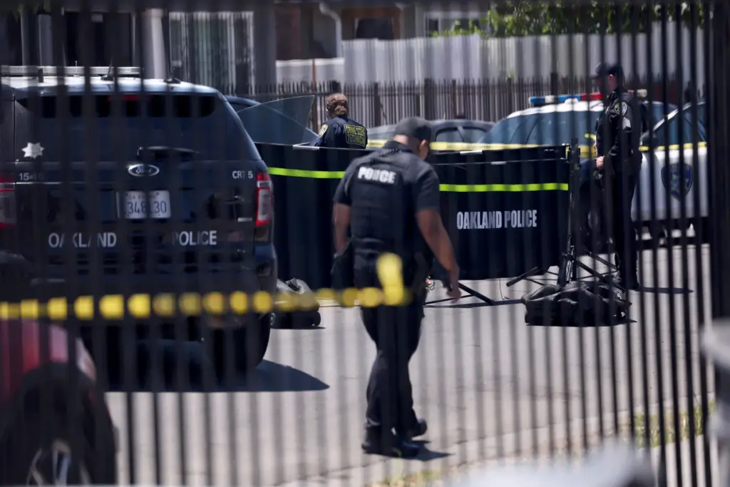 Oakland police investigate a fatal shooting on Seminary Avenue and...