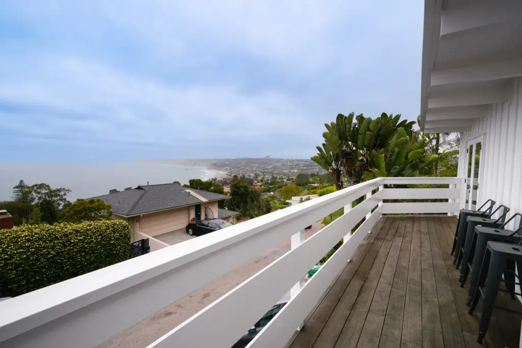 An outdoor deck located on the second level of the...