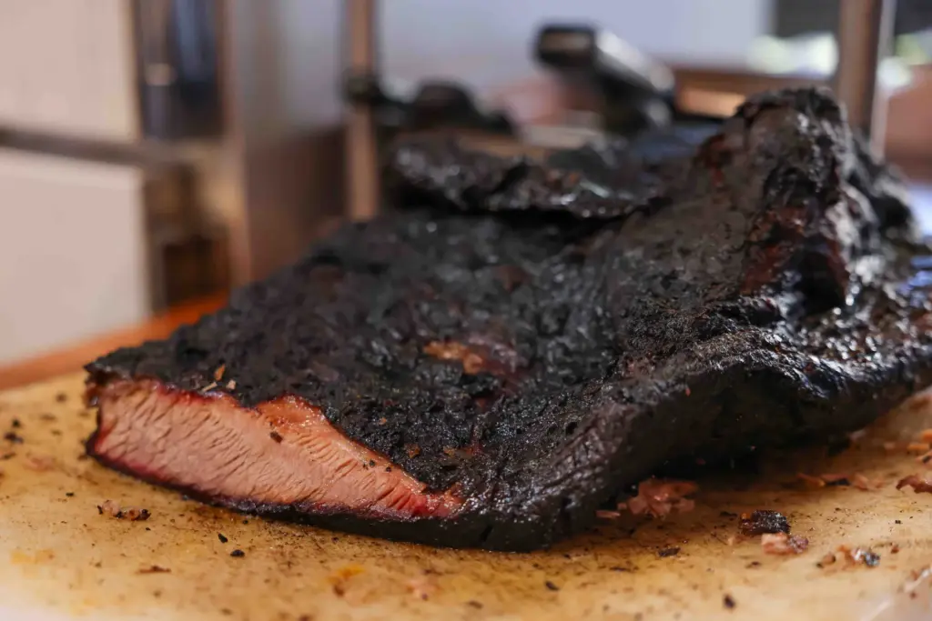 Brisket is pulled out of the oven at Everett &...