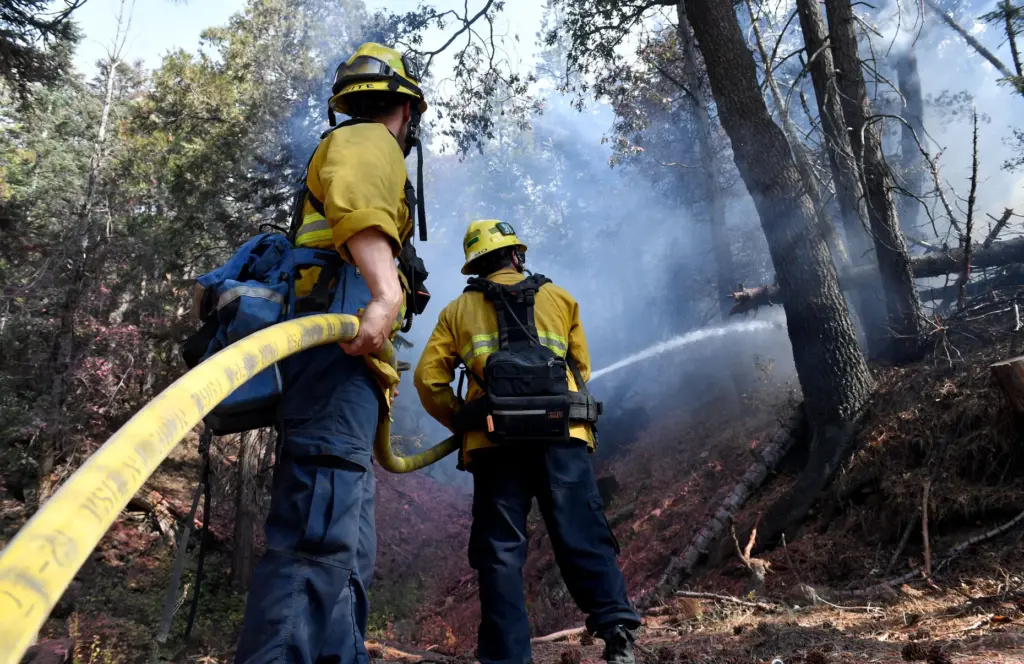 Firefighters out of Orange County put out a hotspot as...