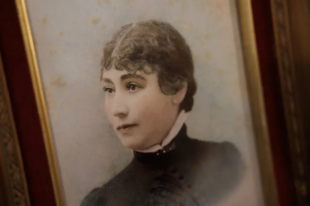 A portrait of Sarah Winchester is displayed at an unveiling...