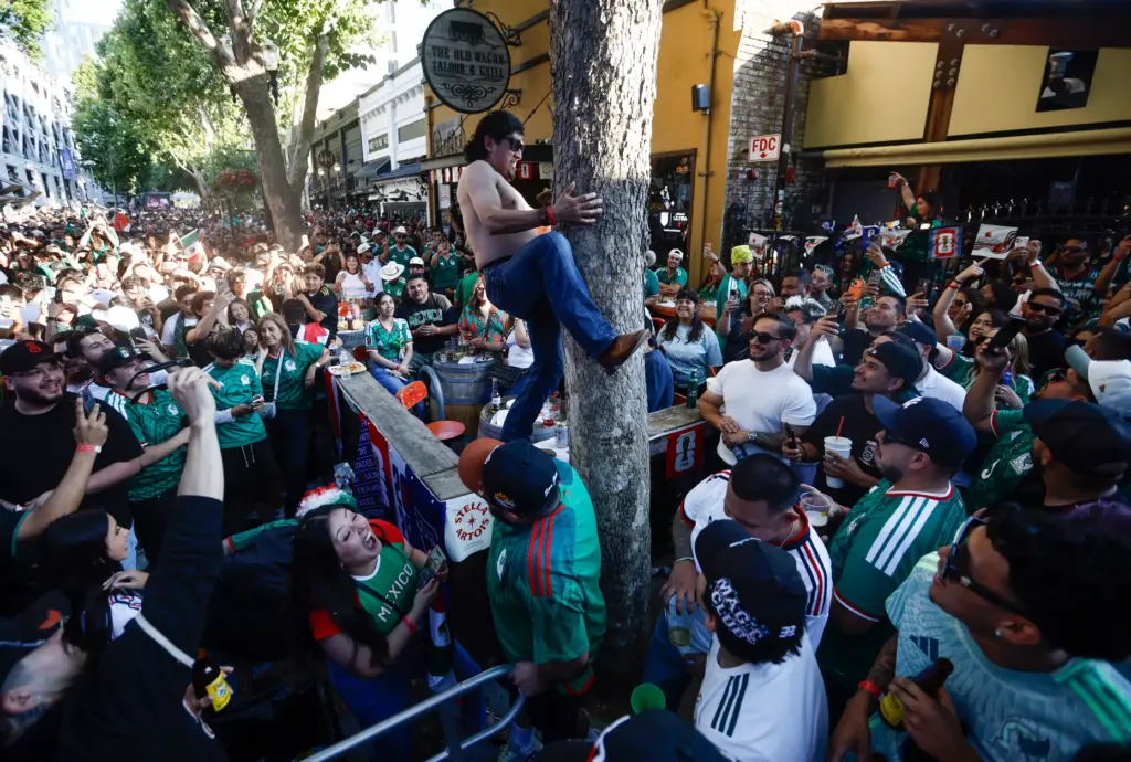 Mexico soccer fans celebrate a goal by Mexico in the...