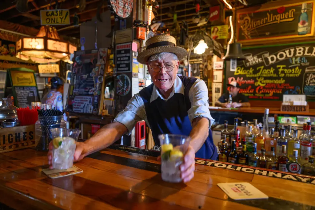 Bartender Scotty Hopkins works behind the bar at Warehouse Cafe...