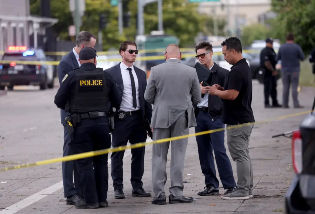 Oakland police and detectives investigate a double fatal crash involving...