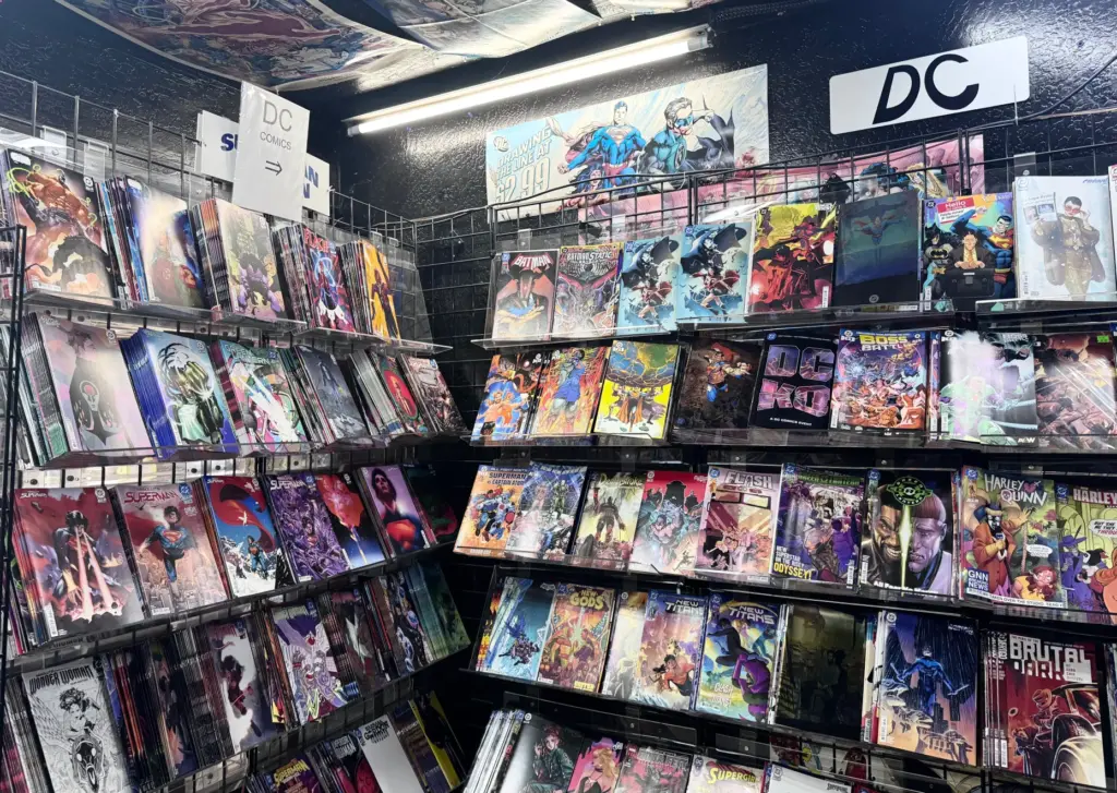 Recent comic books fill the racks at Heroes Comics in...