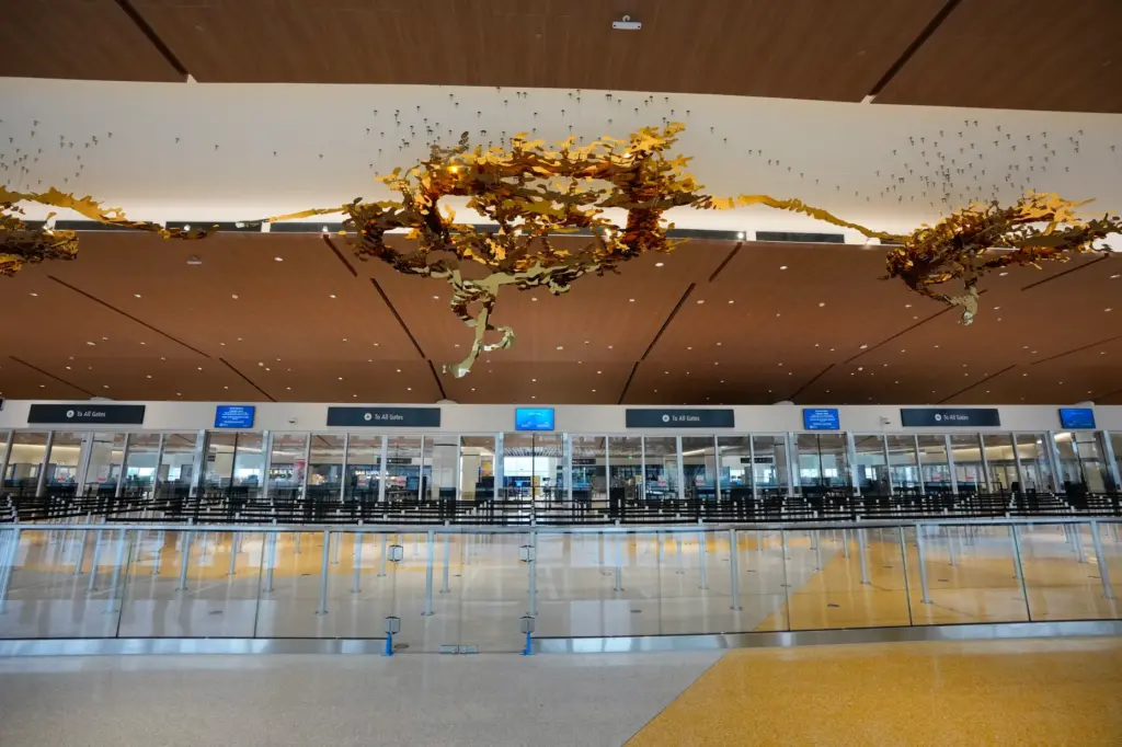The TSA entry point for passengers to clear security before...