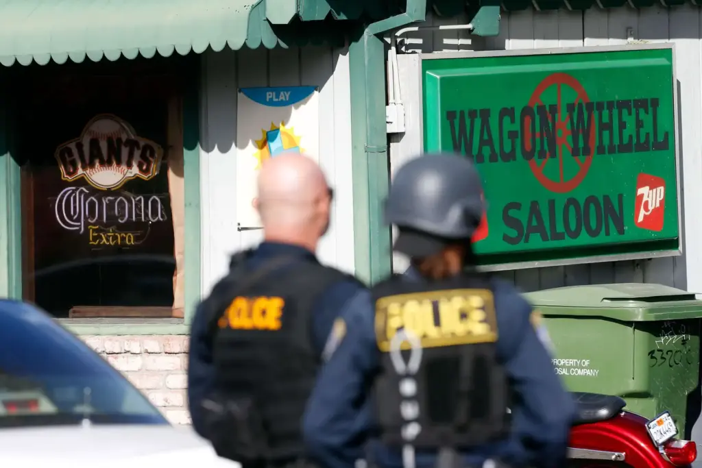 California Highway Patrol officers block off Mendocino Avenue outside the...
