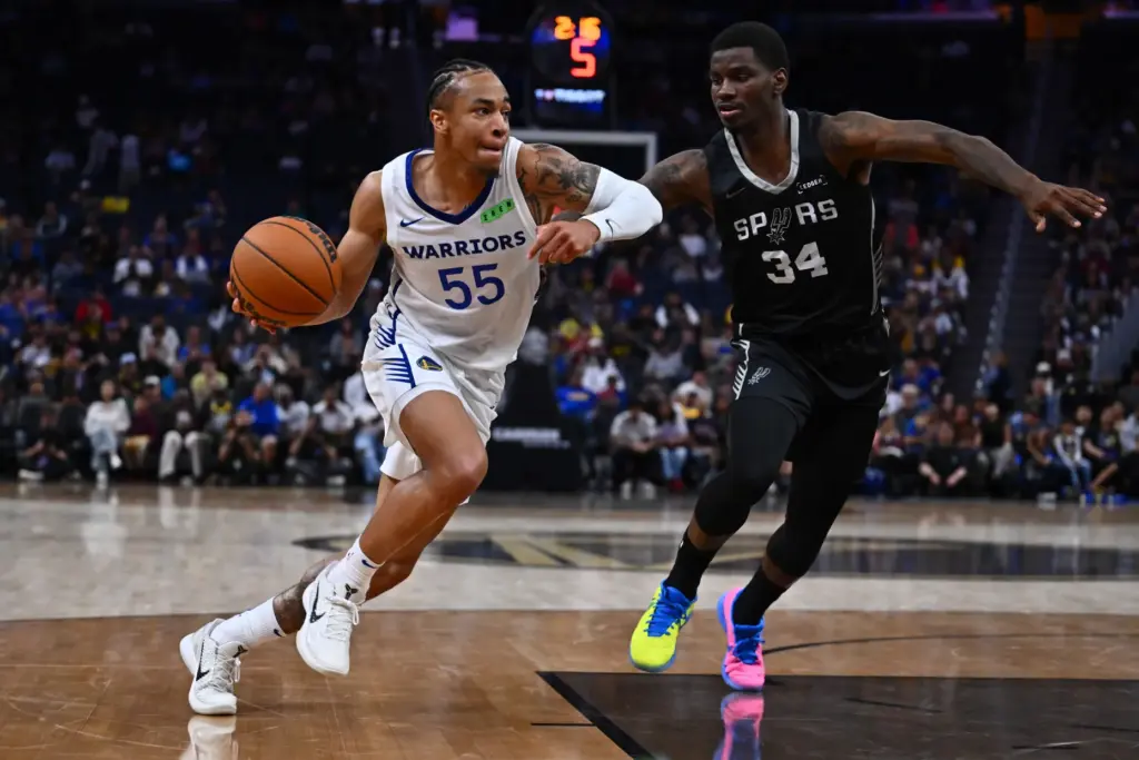 Golden State Warriorsâ Chance McMillian (55) drives against San Antonio...