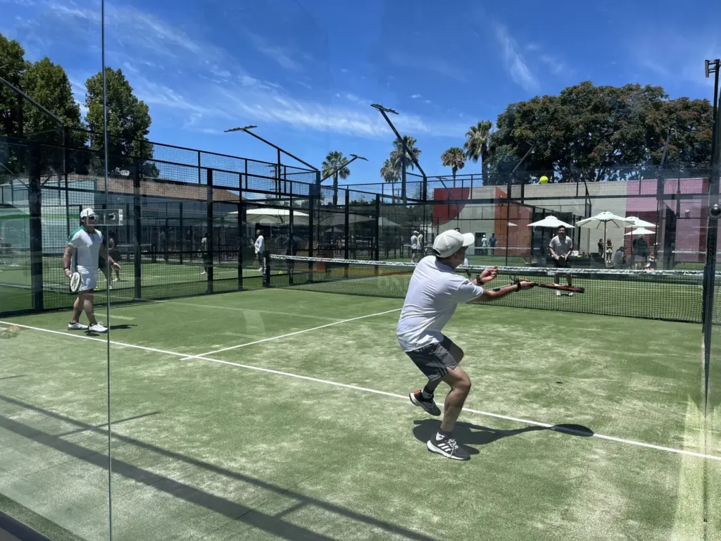 Players compete in a game at Bay Padel sports complex...