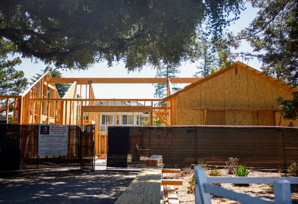 Construction workers build housing in Campbell, Calif., on Tuesday, July...