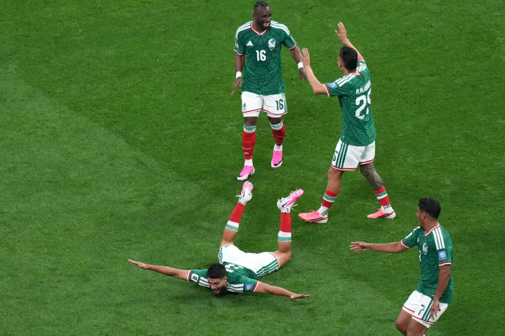 Mexico's Raul Jimenez celebrates with teammates after scoring against Ecuador.