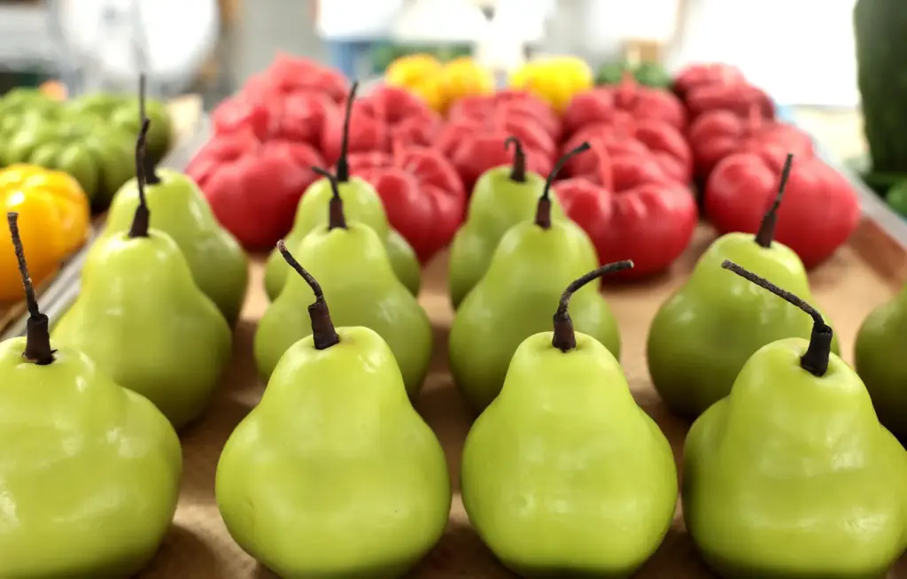 A tray of pear and tomato candles are made at Happy Organics' studio.