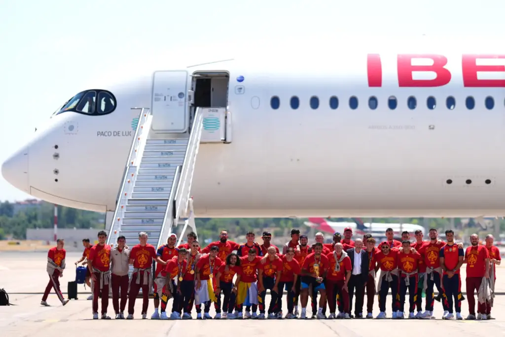 Players from Spain’s national soccer team pose with the World...