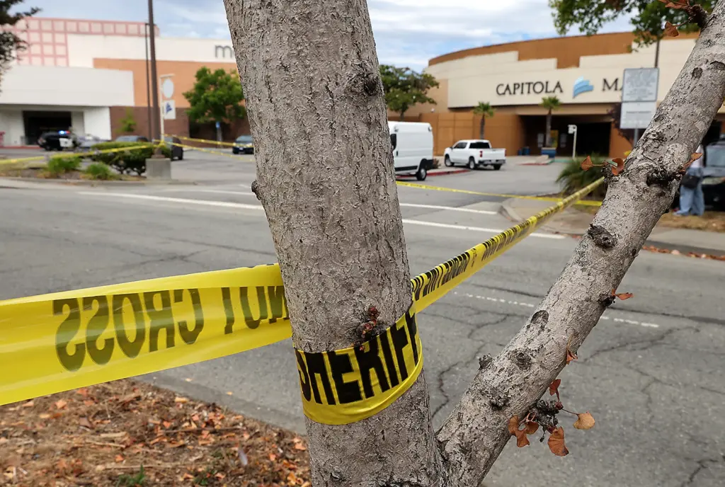Crime scene tape is stretched across Clares Street parking lots...