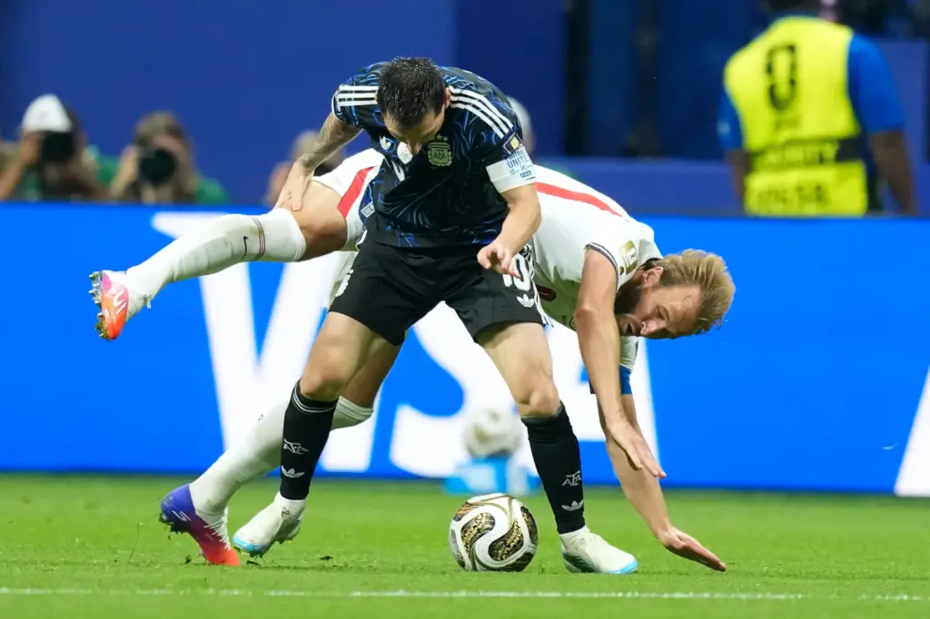 England’s Harry Kane, right, vies for the ball with Argentina’s...
