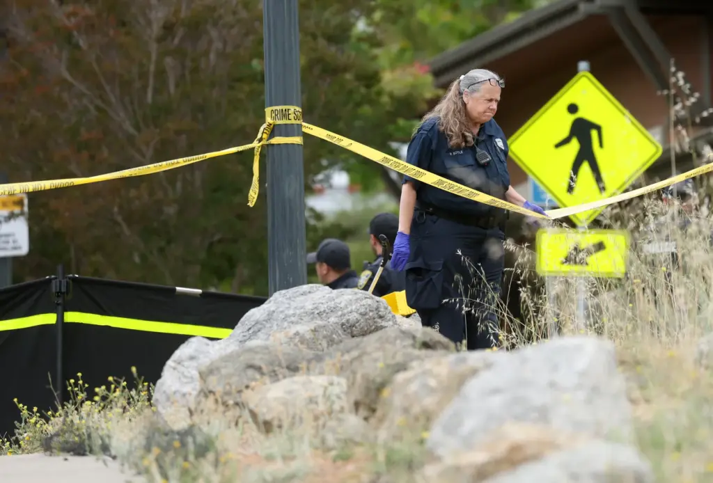 An Oakland police crime scene technician investigates a fatal shooting...