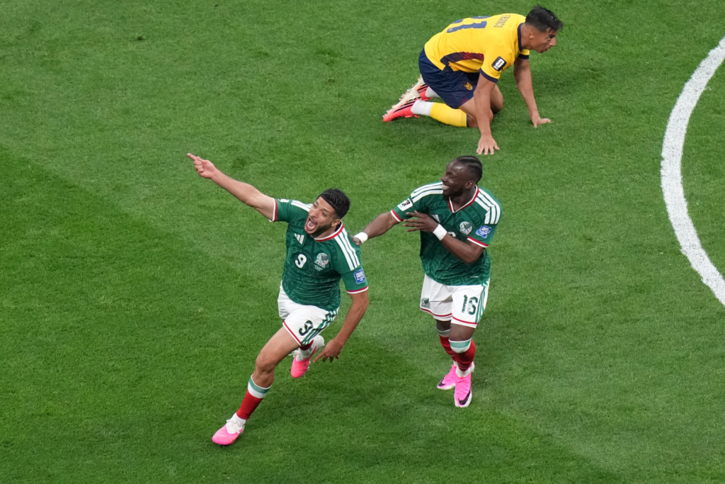 Mexico's Raul Jimenez (9) celebrates with Julian Quinones.
