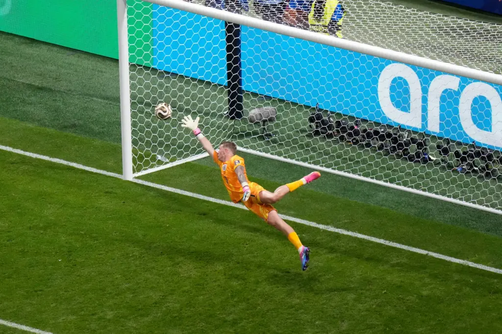 England goalkeeper Jordan Pickford (1) can’t stop Argentina’s first goal...