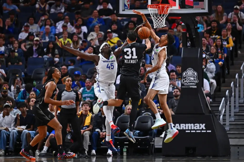 Golden State Warriorsâ Graham Ike (45) blocks a shot by...