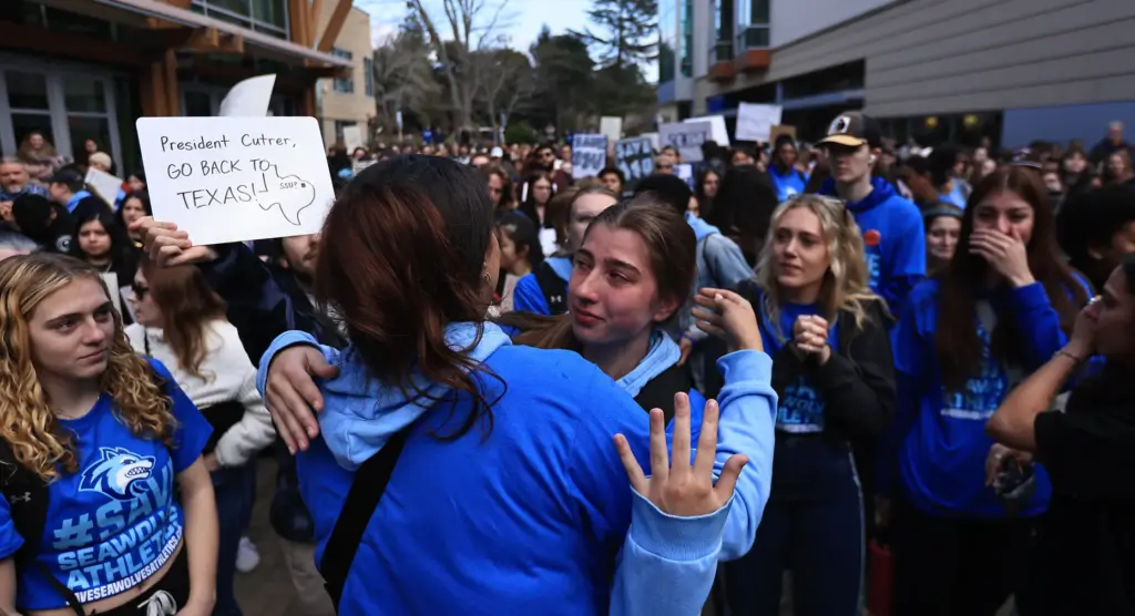 Sonoma State University student athletes fight back tears, Thursday, Jan....