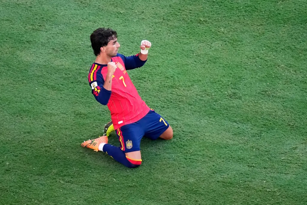 Spain’s Ferran Torres (7) celebrates st the end of the...