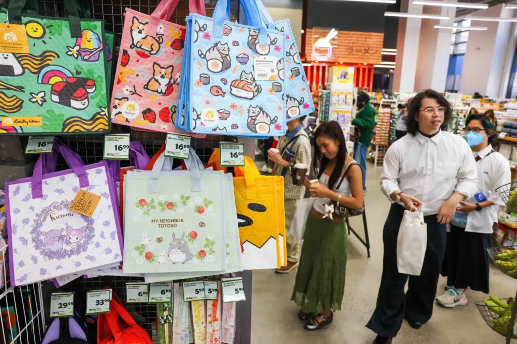 Customers explore Sakura Market during the grand opening of the...