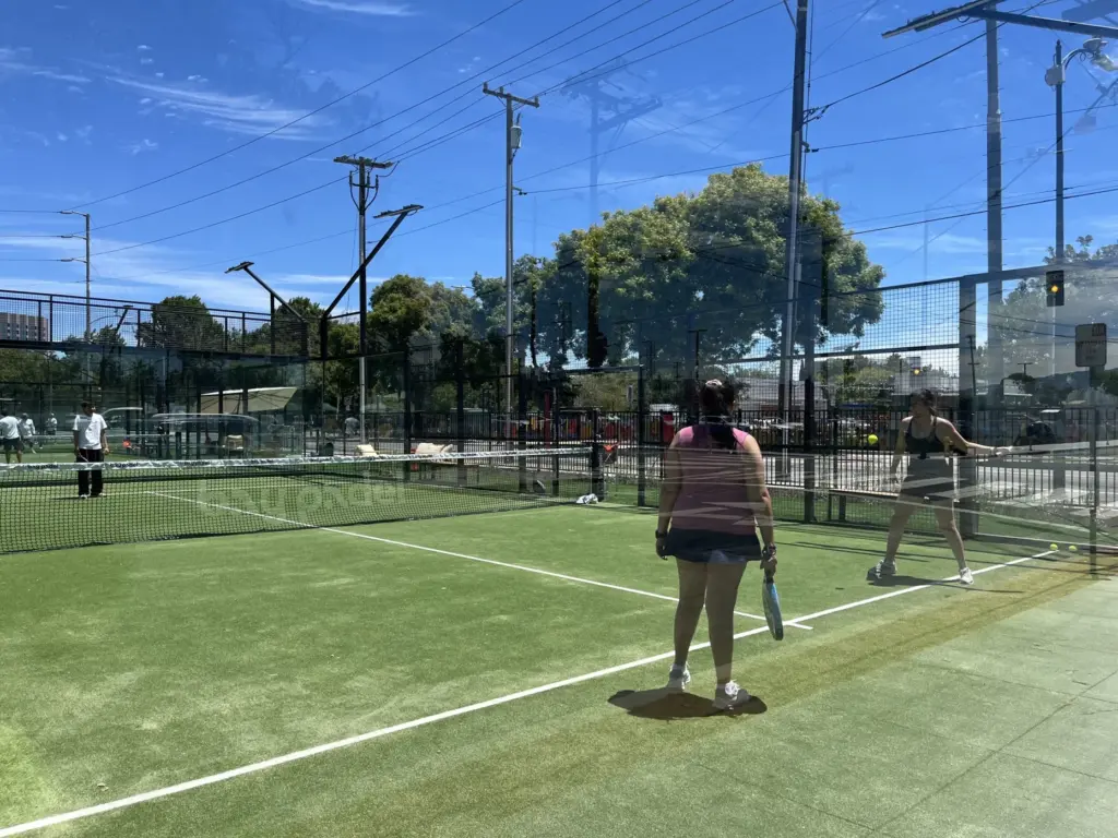 People receive padel lessons at the Bay Padel sports complex...