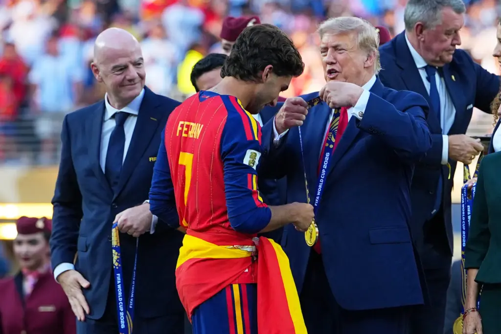 President Donald J. Trump gives Spain’s Ferran Torres (7) winners...