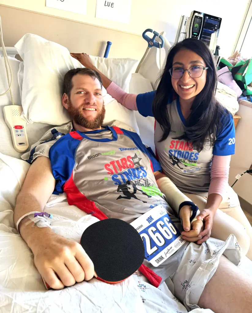 Jeff Garmany wears his Stars and Strides Run shirt while...