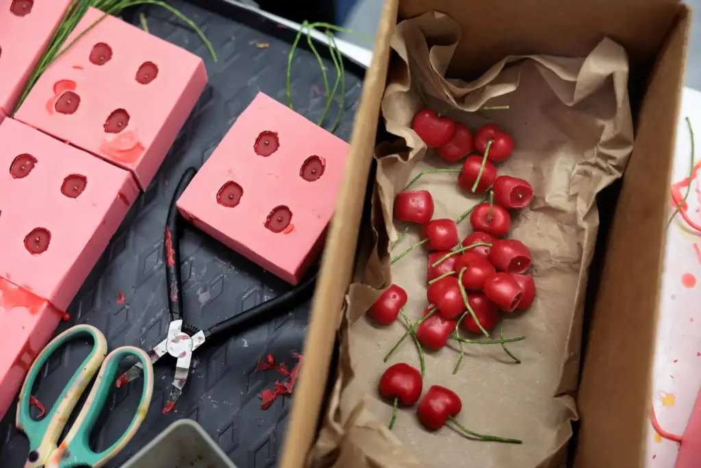 Cherry molds make cherry candles at Happy Organics' studio.