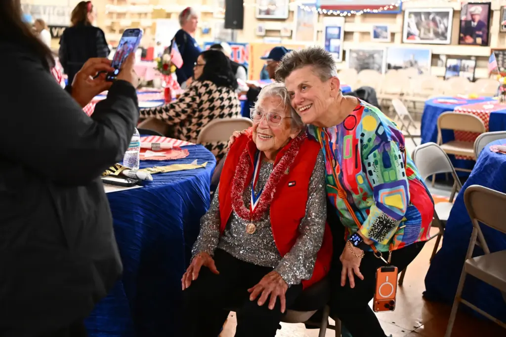 Kathy Taylor, right, of Pinole, gets her photo taken with...