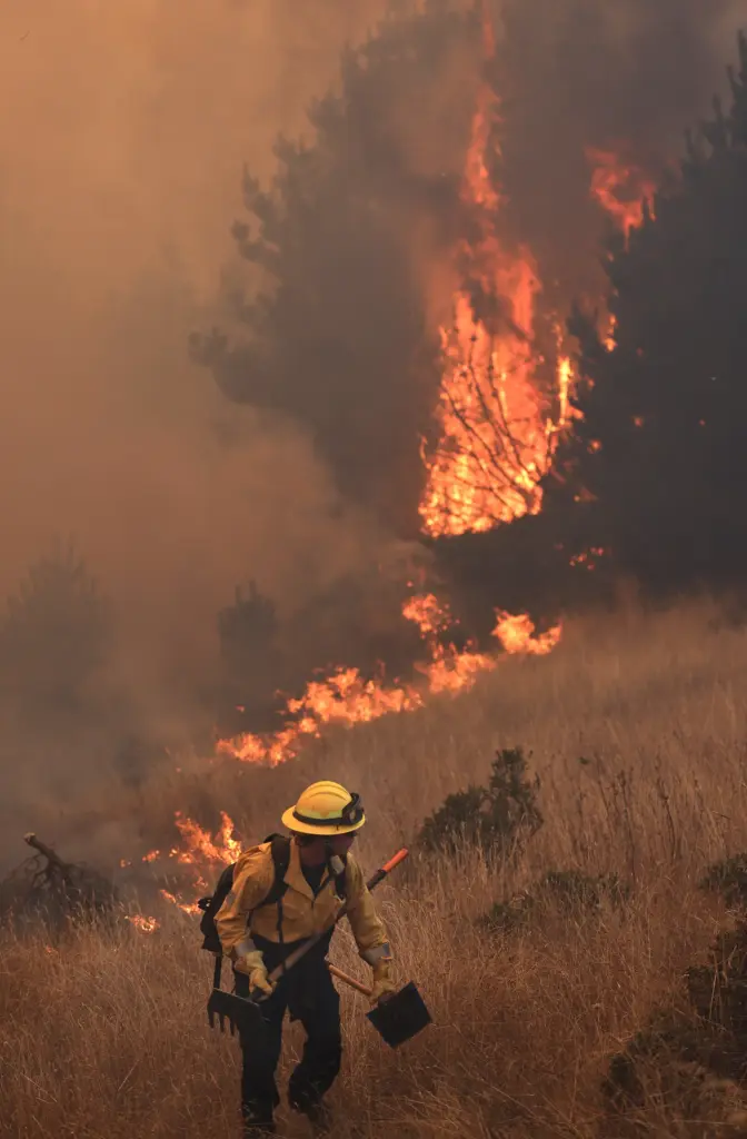 The Woodside Fire moves parallel along Highway 1, Thursday, July...