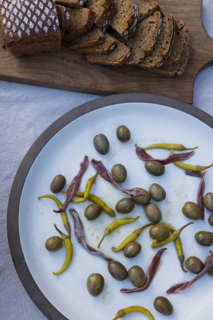 A simple appetizer like olives with chiles is an ideal...