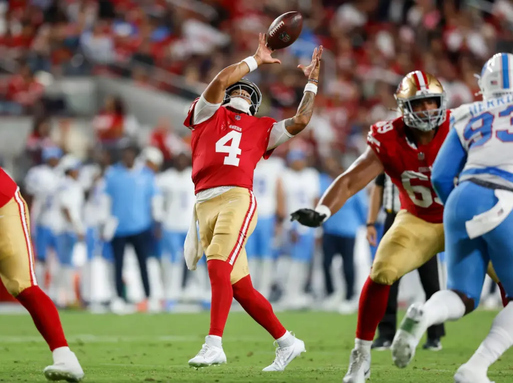 San Francisco 49ers' Adrian Martinez (4) bobbles a snap against...