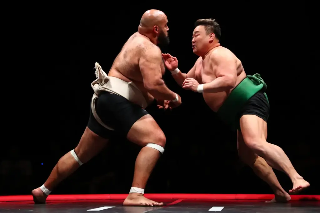 Egypt’s Abdelrahman “Sandstorm” Shalan, left, competes against Japan’s AsahishÅ KÅta...