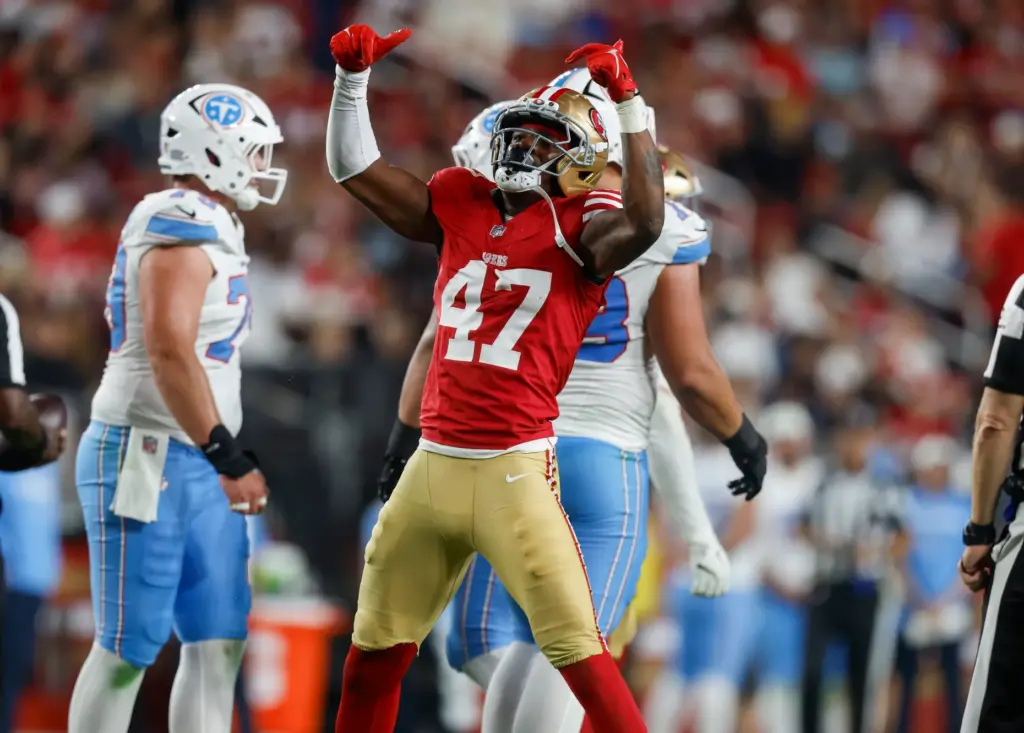 San Francisco 49ers' Josiah Deguara (47) celebrates his sack against...
