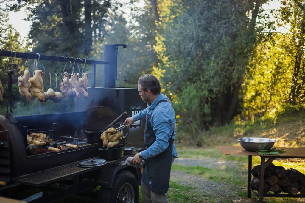 Chef Lee Desrosiers slow-roasts his signature “Hell Chicken” in a...
