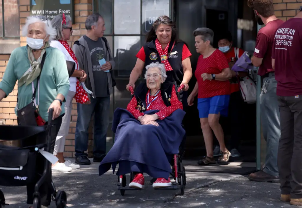 Rosie the Riveter Jeanne Gibson, 100, heads outside as a...